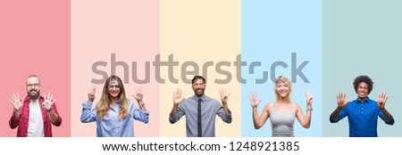 Collage of different ethnics young people over colorful stripes isolated background showing and pointing up with fingers number nine while smiling confident and happy.