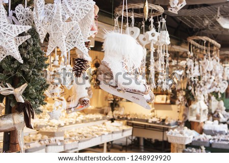 Close up of Christmas market stall in Vienna, Austria. Christmas decorations at a Christmas market. Merry christmas, cute festive decoration, beautiful toys for new year