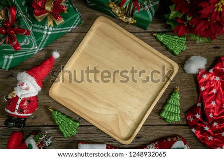 Top view, empty wood dish Decoration with gift box and lights on Christmas Day on wooden table.aerial view