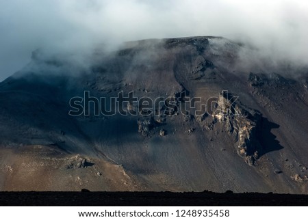 Lava field and mountains near Herðubreið volcano,  on the way to Askja volcano,  black sand desert,  central highlands of Iceland, september