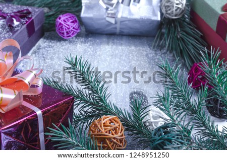 Christmas background branch with needles gift boxes cool colors
