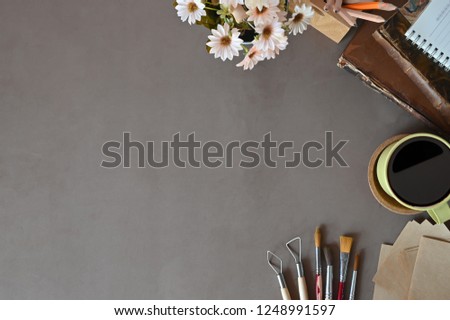 Desk work Top view workspace books coffee, flower decoration on office desk copy space.