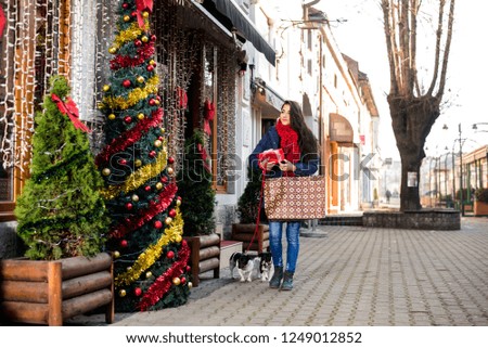 Woman Christmas shopping with dog