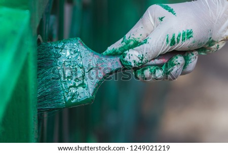 Paint the gate with green color.