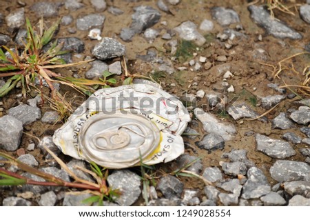can litter discarded on ground