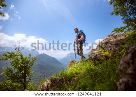 Image of male hiker standing and enjoy the view