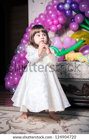 Portrait Baby dressed in white dress