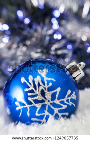 Christmas decoration - blue christmas ball on the lights backgrou