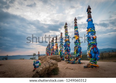 Colorful ribbons on the posts at Lake Baikal in Siberia Russa