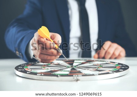 man hand arrow on board on table
