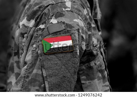 Flag of Sudan on soldiers arm. Sudan flag on military uniform. Army, troops, Africa (collage). Royalty-Free Stock Photo #1249076242