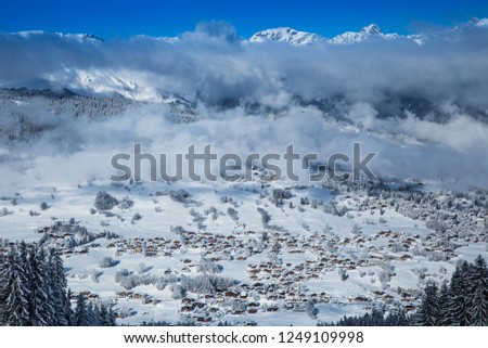 Beautiful view from the ski slopes in snow-caped mountains.