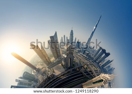 Dubai skyline at sunrise, Little Planet effect. panoramic aerial top view to downtown city landmarks. Famous viewpoint, United Arab Emirates Royalty-Free Stock Photo #1249118290