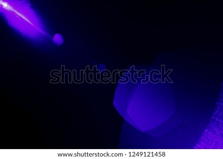 Camera lens flare by blue laser light create hexagons of objective iris shapes of number depending on number of lens surface and interferent effect and moire on digital sensor on dark black background
