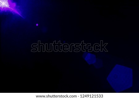 Camera lens flare by blue laser light create hexagons of objective iris shapes of number depending on number of lens surface and interferent effect and moire on digital sensor on dark black background