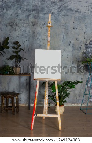 Artist's easel, close-up. The easel of the artist in the interior.