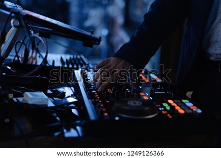 DJ hands on equipment. Turntable top view high quality mixing controller disc jockey in night club