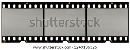 Film strip template with three blank or empty frames, developed 135 type or 35mm film placeholder on white, real film grain
