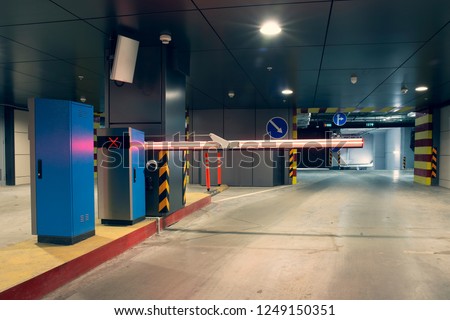 Barrier at entrance to underground parking garage, toned