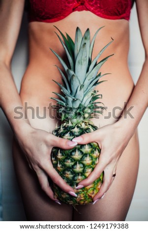 Pineapple is holding a woman