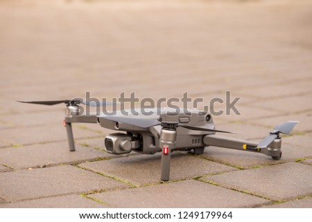 Dron ready for takeoff laid on the ground