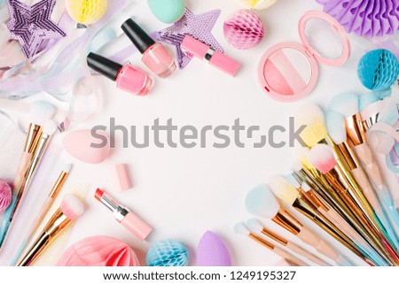 Makeup products and accessory with festive decorations. Flat lay. Beauty concept 