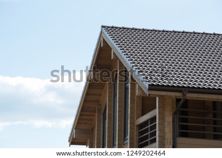 Beautiful wooden house in countryside. Modern style. Natural photo.