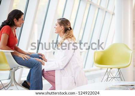 Female Doctor Offering Counselling To Depressed Woman