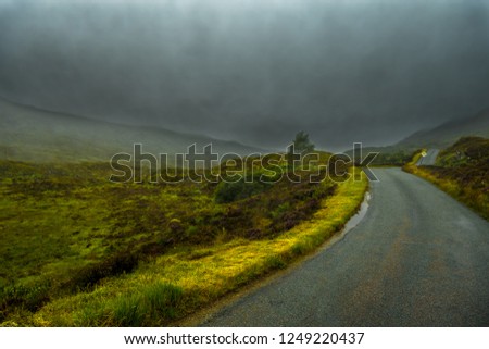 Scenic Single Track Road Through Hills On Isle Of Skye In Scotland