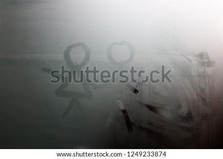 The drawing on the sweaty glass - couple a man and woman