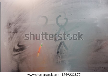 The drawing on the sweaty glass - couple a man and woman