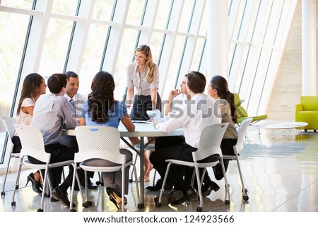Business People Having Board Meeting In Modern Office Royalty-Free Stock Photo #124923566