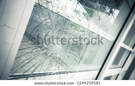 broken facade glass, close up Royalty-Free Stock Photo #1249259581