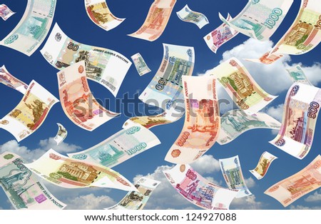 Falling Roubles on sky background. Conceptual business image.