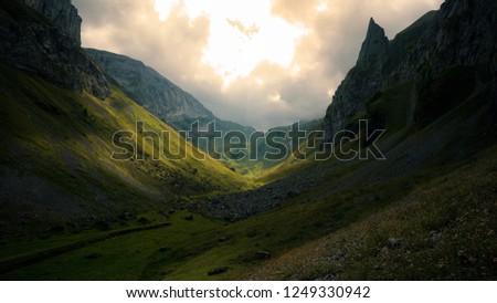 Sun breaking through the clouds in the mountains