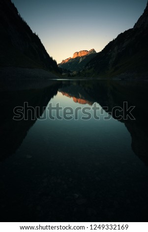 Mountains reflecting on a lake in the swiss mountains