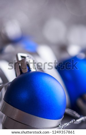 Christmas composition of Christmas tree toys on a blurred silver background