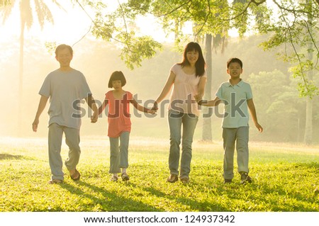 asian family walking in the park