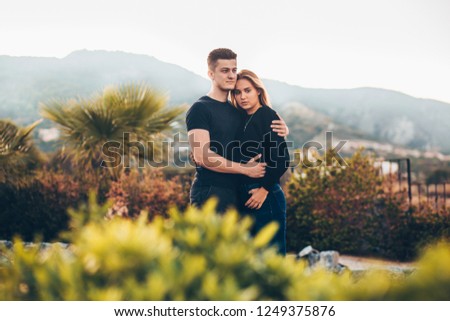 Portrait of beautiful young couple enjoying nature.Young beautiful couple outdoor.Young couple in love enjoying their honeymoon