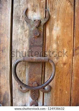 Ancient wooden door rustic metallic door handle detail