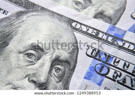 Dolar USA close up. Franklin eyes macro. The texture of the fragment of the dollar bill. USD banknote texture. One hundred American dollars. $ 100. Royalty-Free Stock Photo #1249388953
