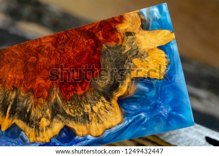 casting epoxy resin Stabilizing Afzelia burl exotic wood blue background texture, Abstract art picture photo, print design and your advertisement, hybrid