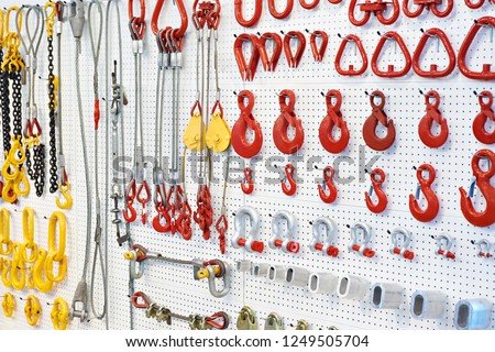 Lifting equipment and chains in exhibition store Royalty-Free Stock Photo #1249505704