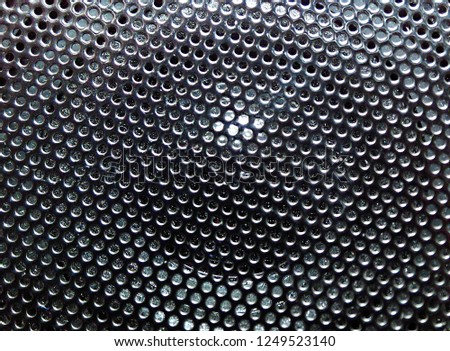 mesh portable speaker close-up. soft focus.