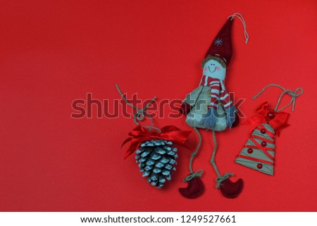 Christmas handmade ornaments decorations red background.Christmas card
