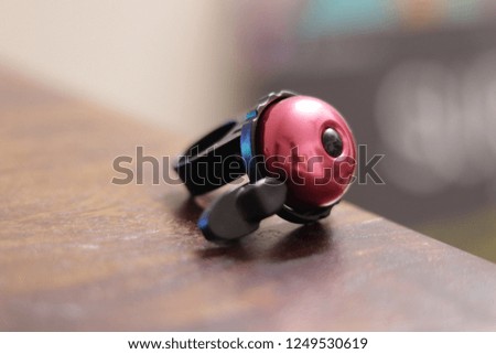 close up of a pink bike bell 