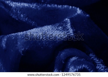 Texture background pattern velor cloth of blue color Velvet is synonymous with luxury One of the most characteristic qualities of velvet is its soft fuzzy heap Pile makes velvet smooth rich in texture
