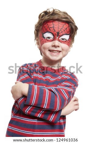 Young boy with face painting spiderman smiling on white background