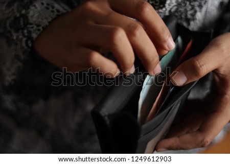 RM cash inside a wallet to shopping 