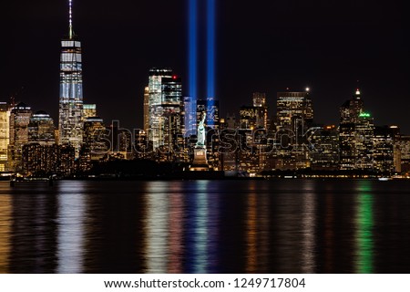 9/11 Memorial Lights with Statue of Liberty shot from New Jersey Royalty-Free Stock Photo #1249717804